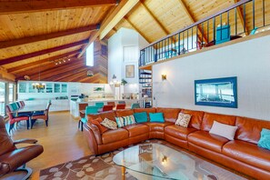 Télévision, cheminée, lecteur de DVD, baby-foot