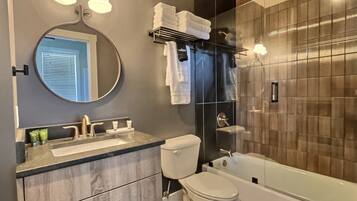 Bathtub, hair dryer, towels