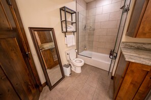 Combined shower/bathtub, hair dryer, towels, soap
