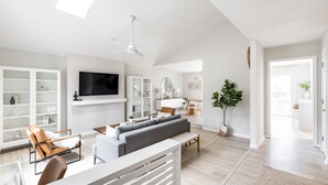 A spacious living room with a sofa, chairs, a TV, and a ceiling fan. - Serene home with all the comforts of a fully designed space- 3 🛏/2 🛁 House (Chesterfield)