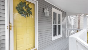 A house with a yellow front door, white shutters, and a white porch railing. - Serene home with all the comforts of a fully designed space- 3 🛏/2 🛁 House (Chesterfield)