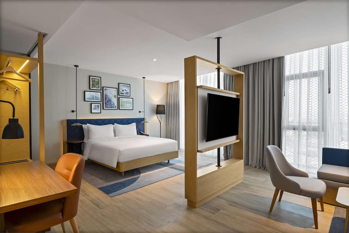 Deluxe Room, 1 King Bed with Sofa bed | Premium bedding, down duvets, in-room safe, desk