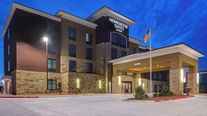 A hotel with a stone facade, a sign for Homewood Suites by Hilton, and an American flag. - Homewood Suites by Hilton Oklahoma City Quail Springs (Oklahoma City)