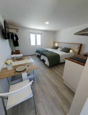1 bedroom, desk, iron/ironing board, travel crib