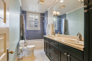 Combined shower/tub, hair dryer, towels, soap