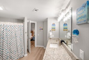 Combined shower/bathtub, hair dryer, towels - Sandcastle Condominiums Unit 504 (Port Aransas)