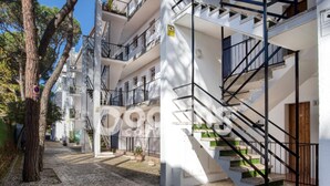 A multi-story residential building with a central staircase, balconies, and a cobblestone courtyard. - APARTMENT FOR 6 PEOPLE WITH PARKING 2 MINUTES FROM THE BEACH (Platja d'Aro)