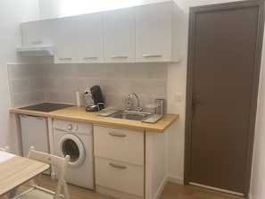 Fridge, microwave, stovetop, coffee/tea maker