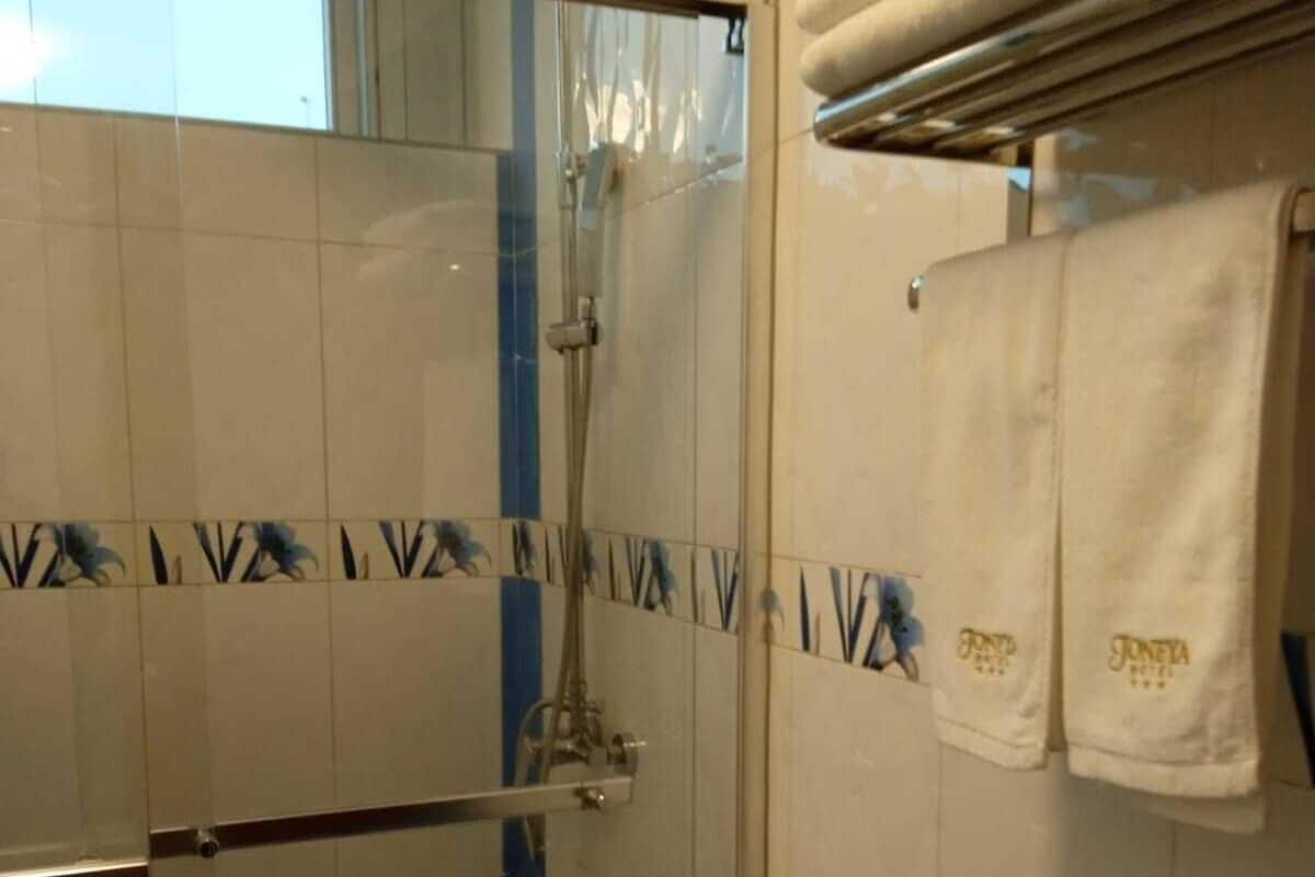 Comfort Double Room, 2 Queen Beds, Hot Tub, City View | Bathroom | Separate tub and shower, jetted tub, rainfall showerhead, towels