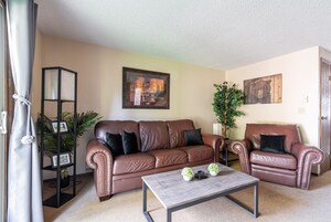 Townhome | Living area | 46-inch flat-screen TV with satellite channels, TV, fireplace