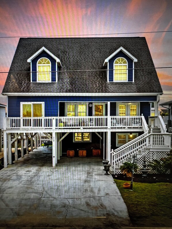 A two-story house with a balcony, a staircase, and a porch. - WONDERFUL VACATION OPPORTUNITY, STEPS FROM BEACH, SLEEPS 14 (North Myrtle Beach)