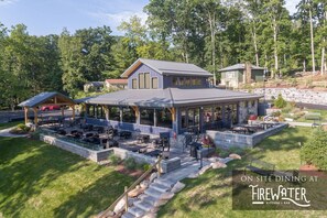 Enjoy dining al fresco at Firewater Kitchen & Bar, surrounded by a beautifully landscaped garden and a tranquil patio area.