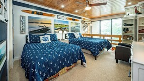 A cabin-style bedroom with two beds, wooden ceiling, and nautical-themed decor. - Will O' The Wisp: 514C One Bedroom/One Bath (Oakland)