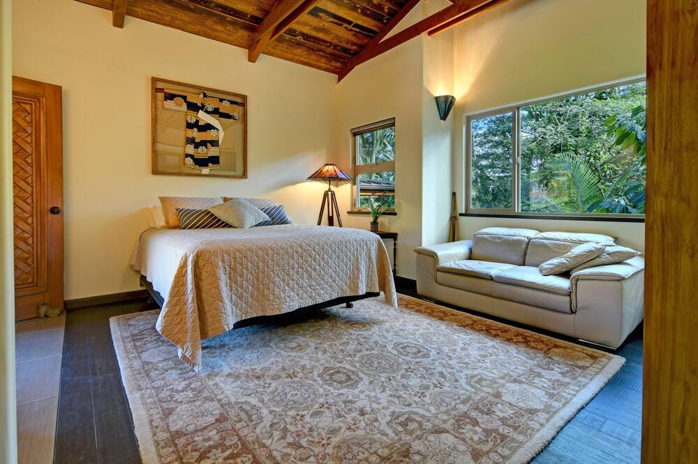 Escape to your private villa perched on a cliff with a jungle view