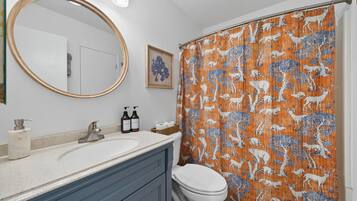 Combined shower/tub, hair dryer, towels, soap