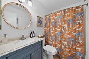 Combined shower/tub, hair dryer, towels, soap