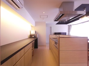 Fridge, microwave, cookware/dishes/utensils, dining tables