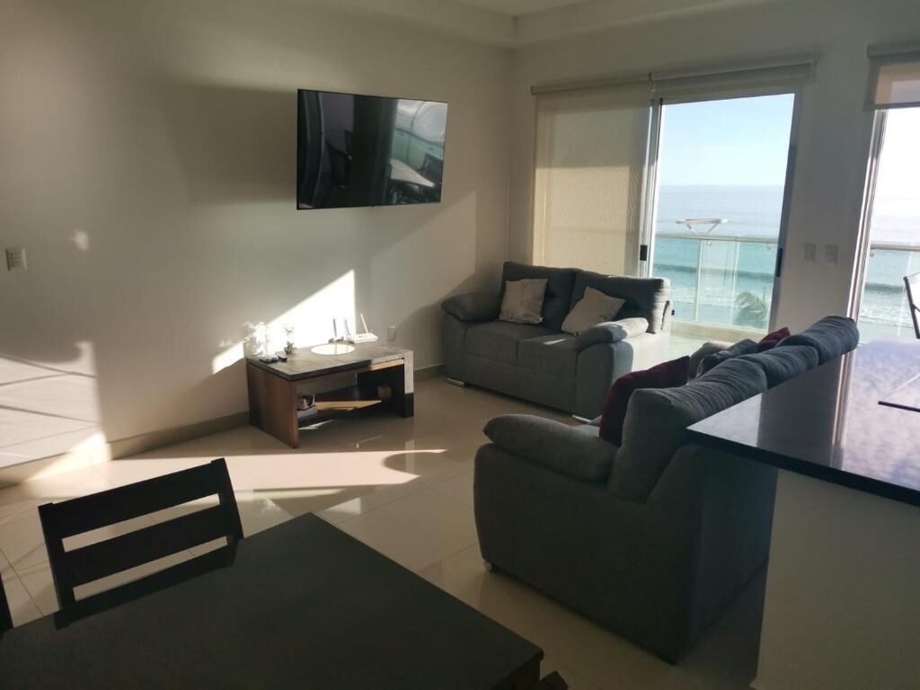 Beautiful yet cozy beach condo in perfect location with breathtaking ocean views