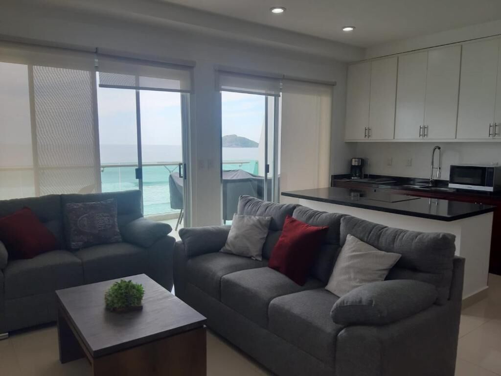 Beautiful yet cozy beach condo in perfect location with breathtaking ocean views