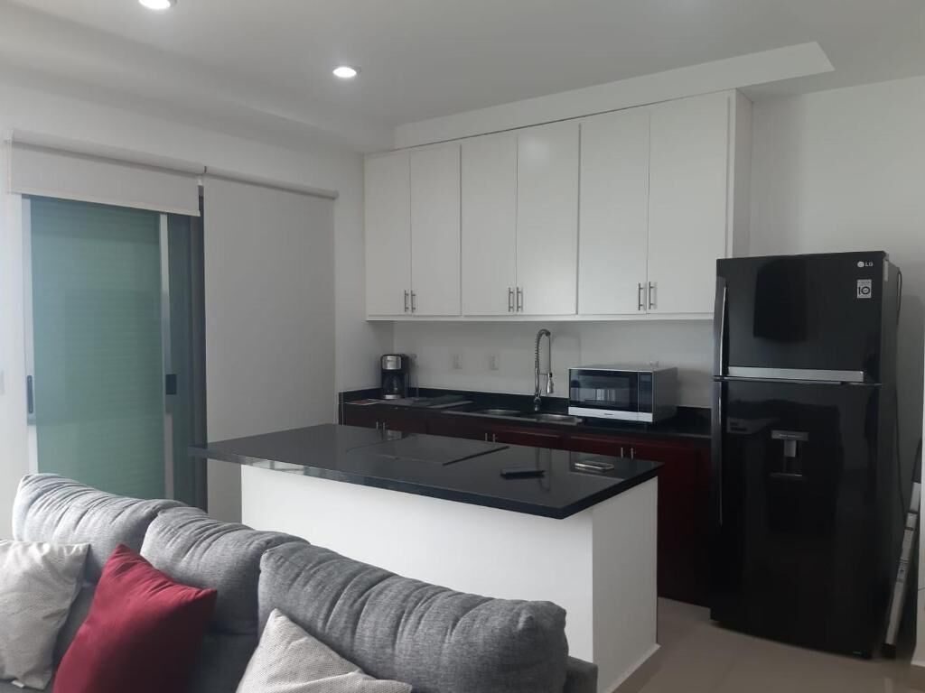 Beautiful yet cozy beach condo in perfect location with breathtaking ocean views