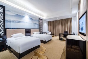 A hotel room with two beds, a TV, a desk, and a large window. - Guopeng International Hotel (Pingnan)