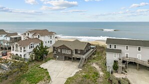 A coastal residential area with houses overlooking the beach. - 2877 - Carolina Dreamin - Oceanfront Duck Escape w/ Hot Tub & Views (Kitty Hawk)