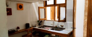 Fridge, coffee/tea maker, blender, cookware/dishes/utensils