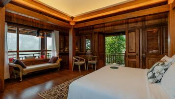A wooden room with a bed, a bench, and a table.