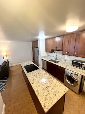 Microwave, dishwasher, coffee/tea maker, cookware/dishes/utensils