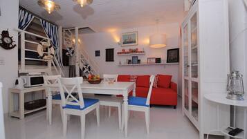 Traditional Duplex, 1 Bedroom | Living area | 30-inch flat-screen TV with digital channels, TV