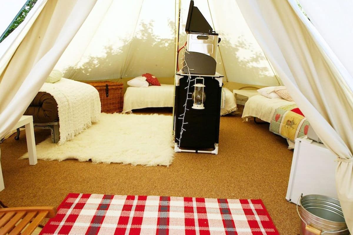 4 Berth Canvas Village Bell Tent | 3 bedrooms, individually decorated, individually furnished, bed sheets