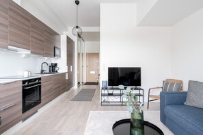 Exclusive-huoneisto | Olohuone | 43–tuumainen äly-TV, jossa kaapelikanavat