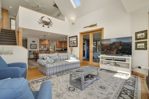 TV, fireplace - Egret's Cove | Bayfront Oyster Bay Retreat w/ Hot Tub, Screened Porch, Dock & Fenced Yard for Pets (Chincoteague Island)