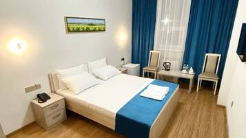 Desk, laptop workspace, free WiFi, bed sheets