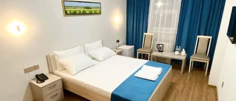 Desk, laptop workspace, free WiFi, bed sheets