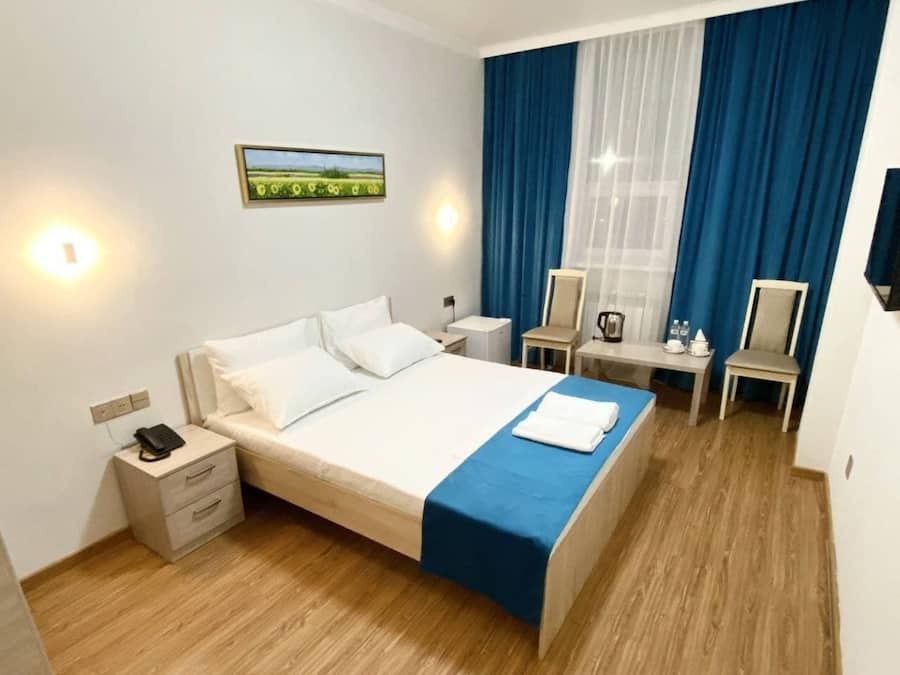 Desk, laptop workspace, free WiFi, bed sheets