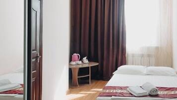 Desk, laptop workspace, free WiFi, bed sheets