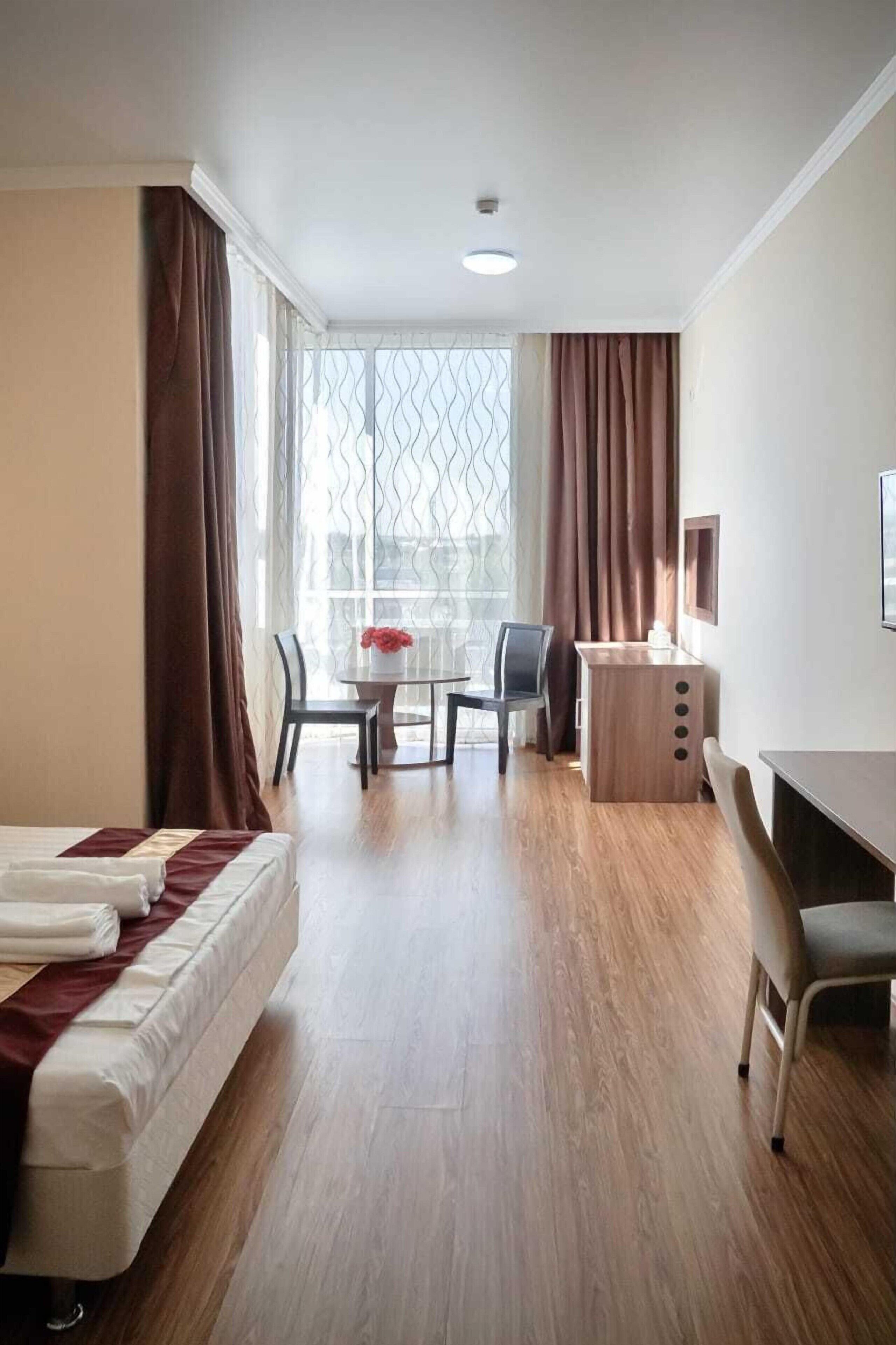 Desk, laptop workspace, free WiFi, bed sheets