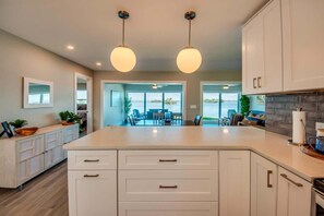 Fridge, microwave, oven, stovetop - 274 Curlew St. - Modern Bayfront Home with Pool! (Fort Myers Beach)