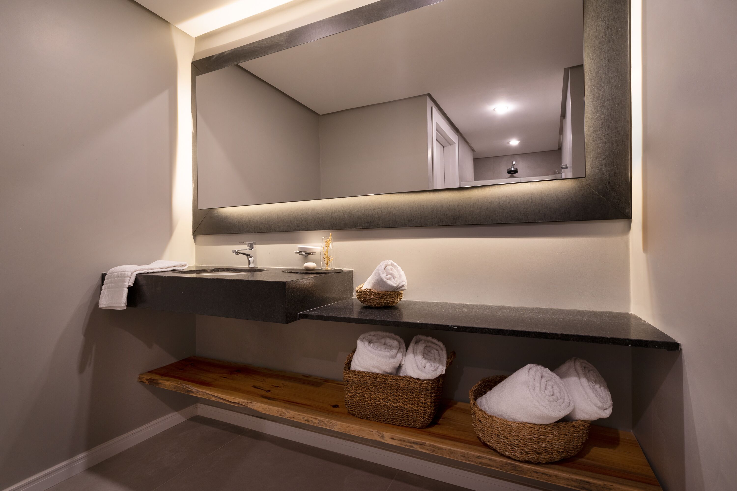 designer toiletries, hair dryer, towels