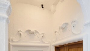 A white door with a small window above it, a wooden door next to it, and a decorative ceiling. - Room Nino 2 - One Bedroom Apartment, Sleeps 2 (Dubrovnik)