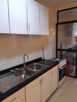 Fridge, cookware/dishes/utensils - kaisa apartment (Nairobi)