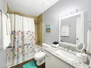 Combined shower/tub, hair dryer, towels, soap
