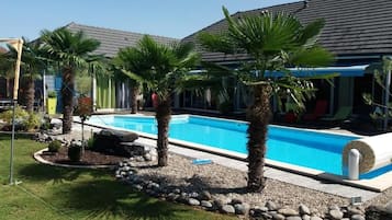 Seasonal outdoor pool, pool umbrellas, sun loungers