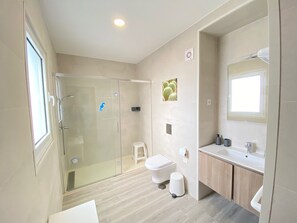 Shower, towels, toilet paper