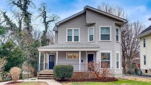 A two-story house with a front porch, a small front yard, and a mailbox. - Excellent 3BR/2BA PRIME Location! (Louisville)
