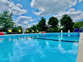 Seasonal outdoor pool, open 10:00 AM to 11:00 PM, pool umbrellas