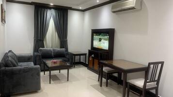 Classic Apartment | Living area | 42-inch LED TV with satellite channels, TV