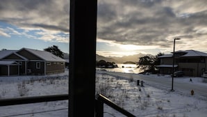 A snowy landscape with houses and a road. - 730 Alice Loop: 3  BR, 2  BA Duplex in Sitka, Sleeps 6 (Sitka)