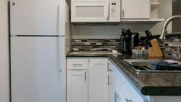 Fridge, microwave, stovetop, coffee/tea maker